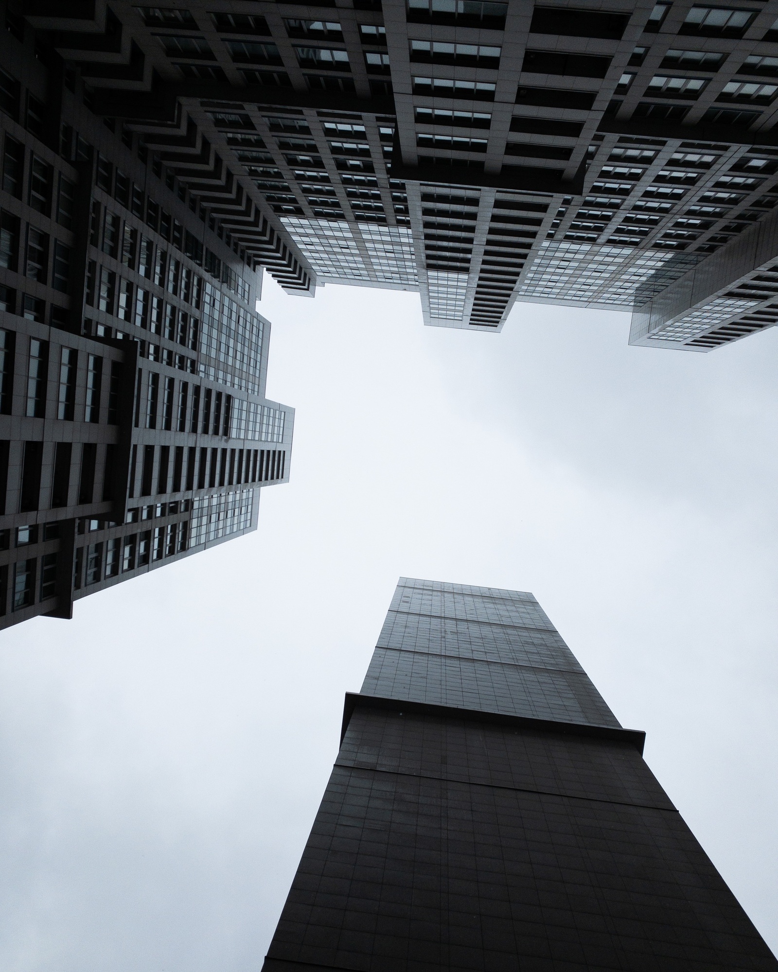 High buildings grey sky dark